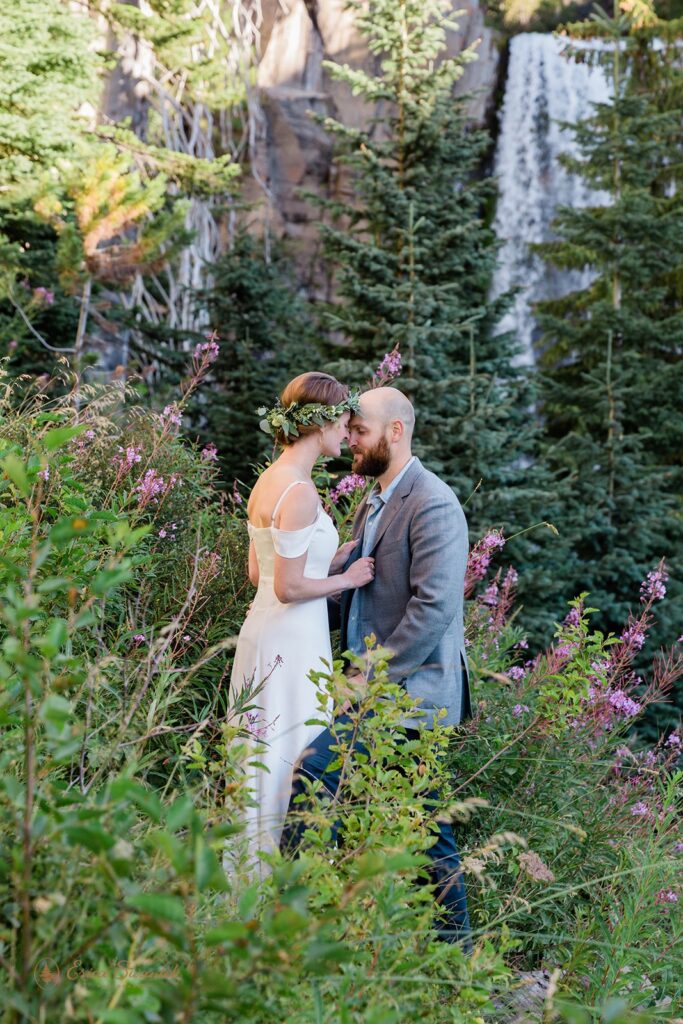 bride and groom snuggling during their pnw waterfall elopement