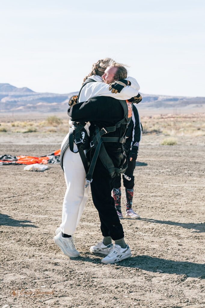 excited elopement couple after their successful skydiving experience