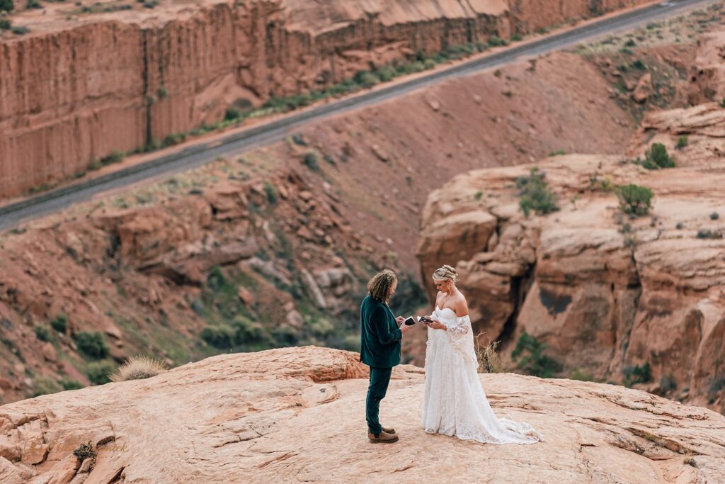 adventurous moab desert elopement ceremony at corona arch