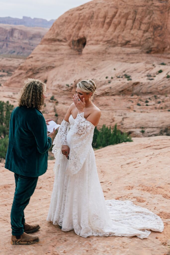 adventurous moab desert elopement ceremony at corona arch