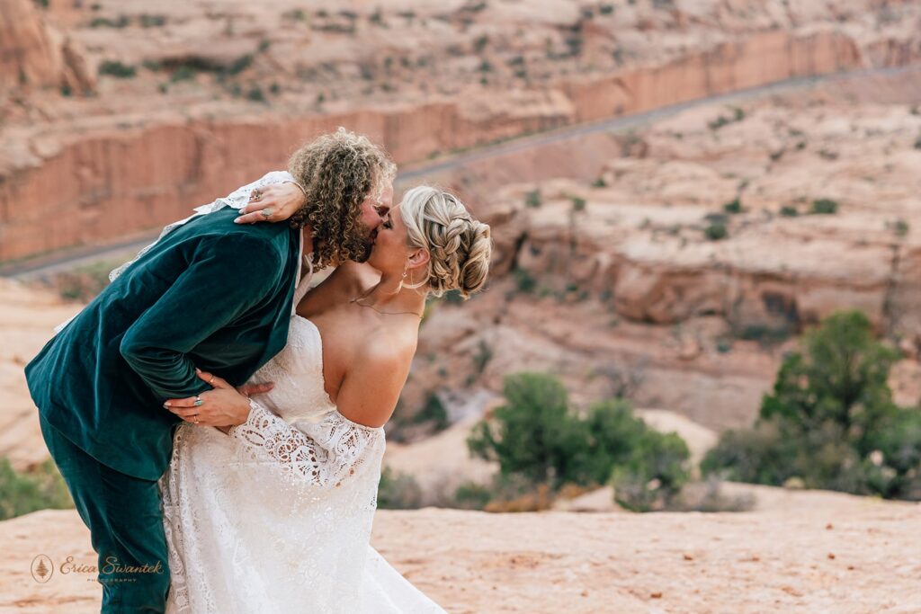 bride and groom first kiss
