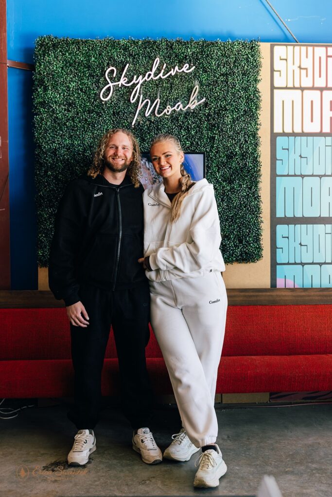 adventurous bride and groom getting ready for their skydiving wedding in moab