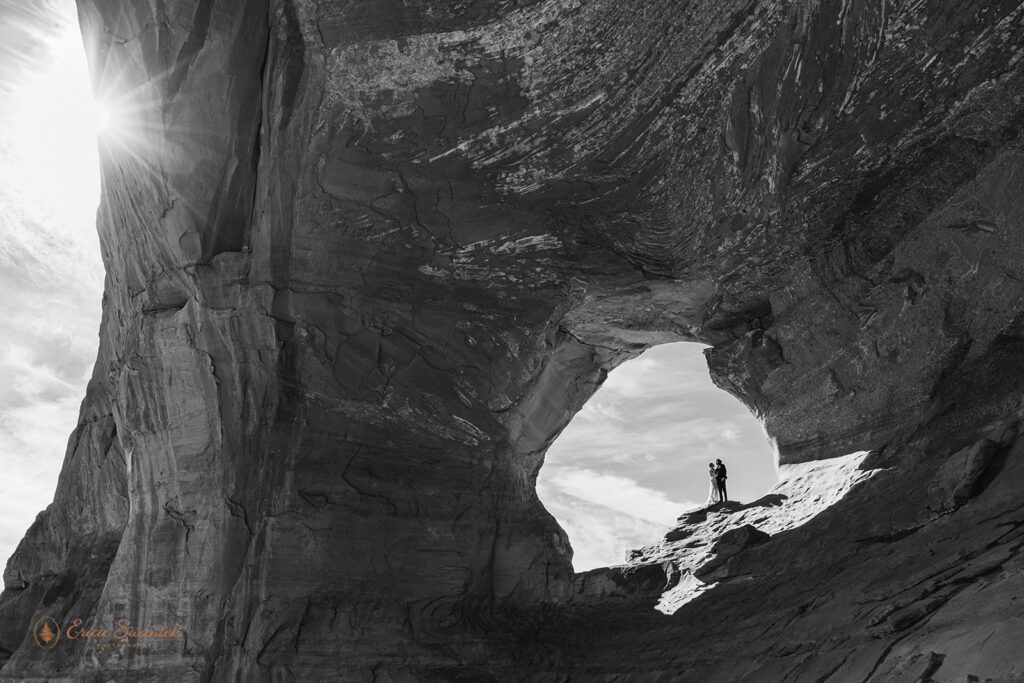 adventure elopement couple at looking glass arch in moab