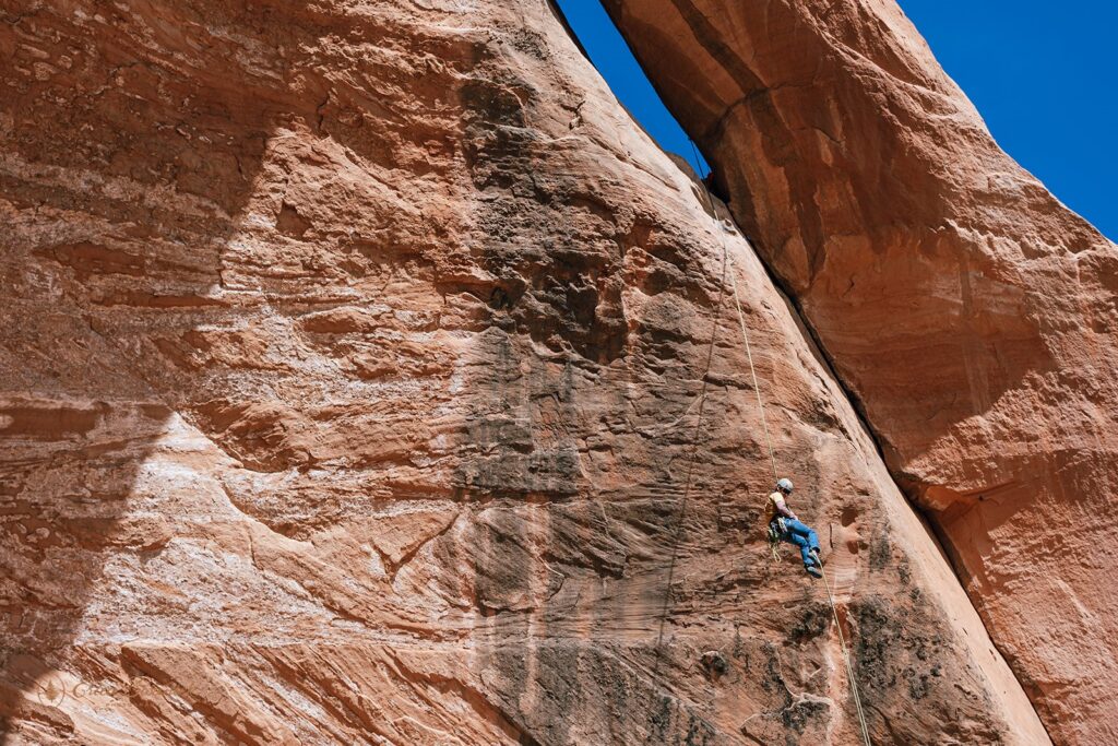 people rappelling in Moab