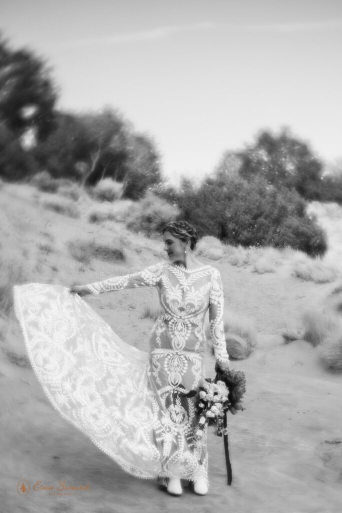 bride in front of red rock formations during western elopement in moab