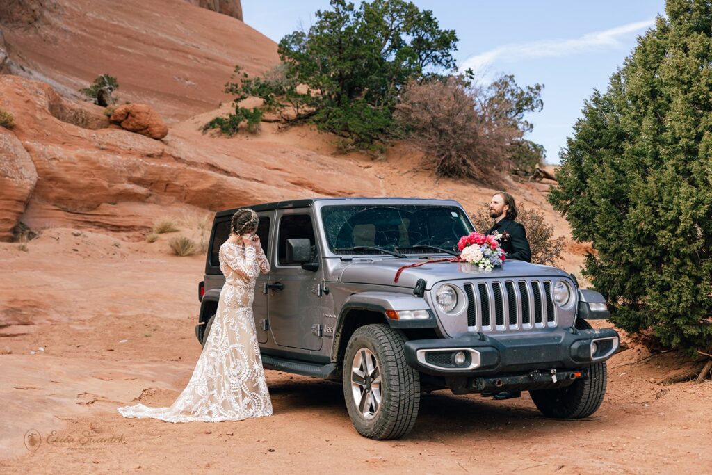 bride and groom at their jeep