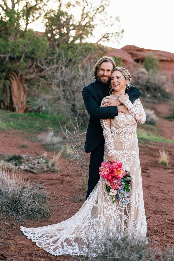 playful elopement couple in the red desert in moab