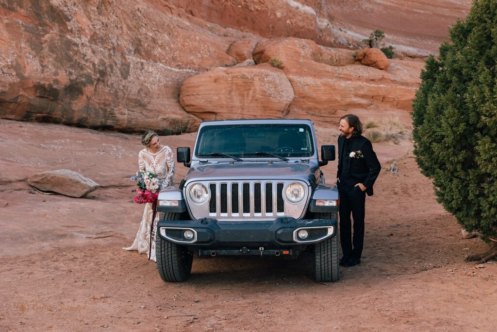 bride and groom at their jeep