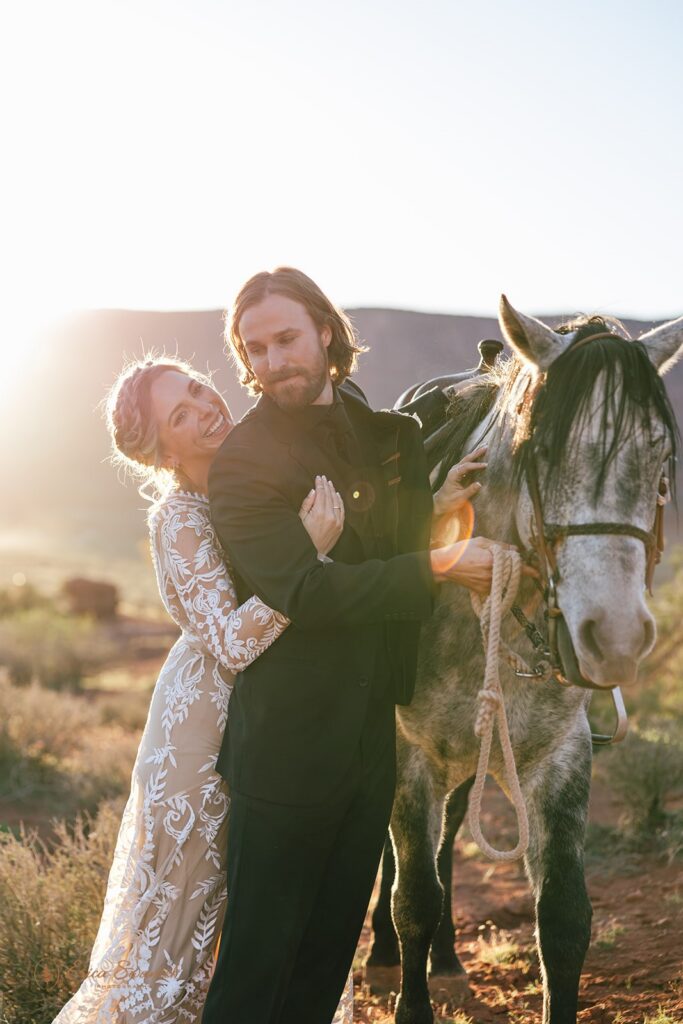 adventurous elopement couple with a horse during their moab elopement day