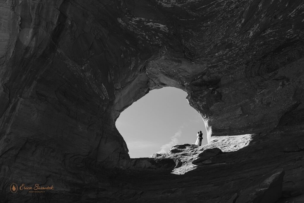 bride and groom at the looking glass arch during their moab elopement