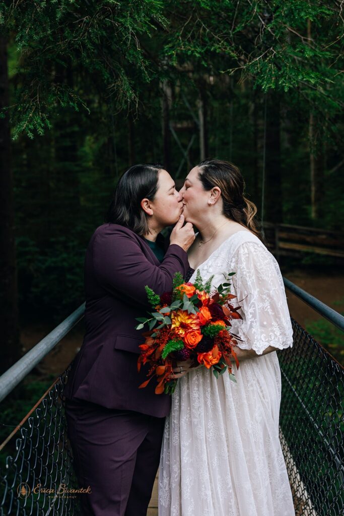 sweet lgbtq elopement couple during their lush forest elopement in the pnw