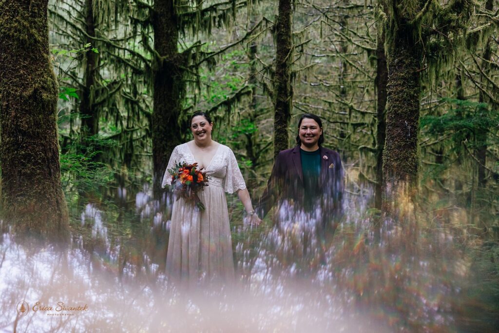 sweet lgbtq elopement couple during their lush forest elopement in the pnw
