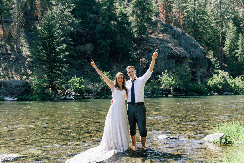 A couple ends their two day intimate wedding experience by jumping in the Naches River in Washington.