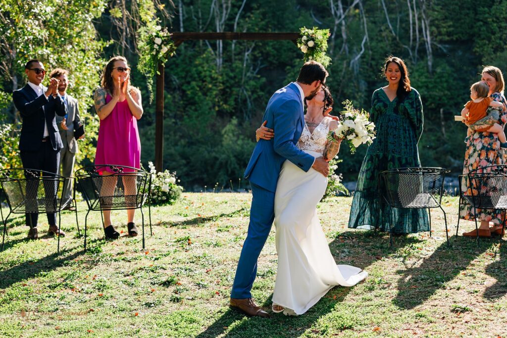 bride and groom first kiss