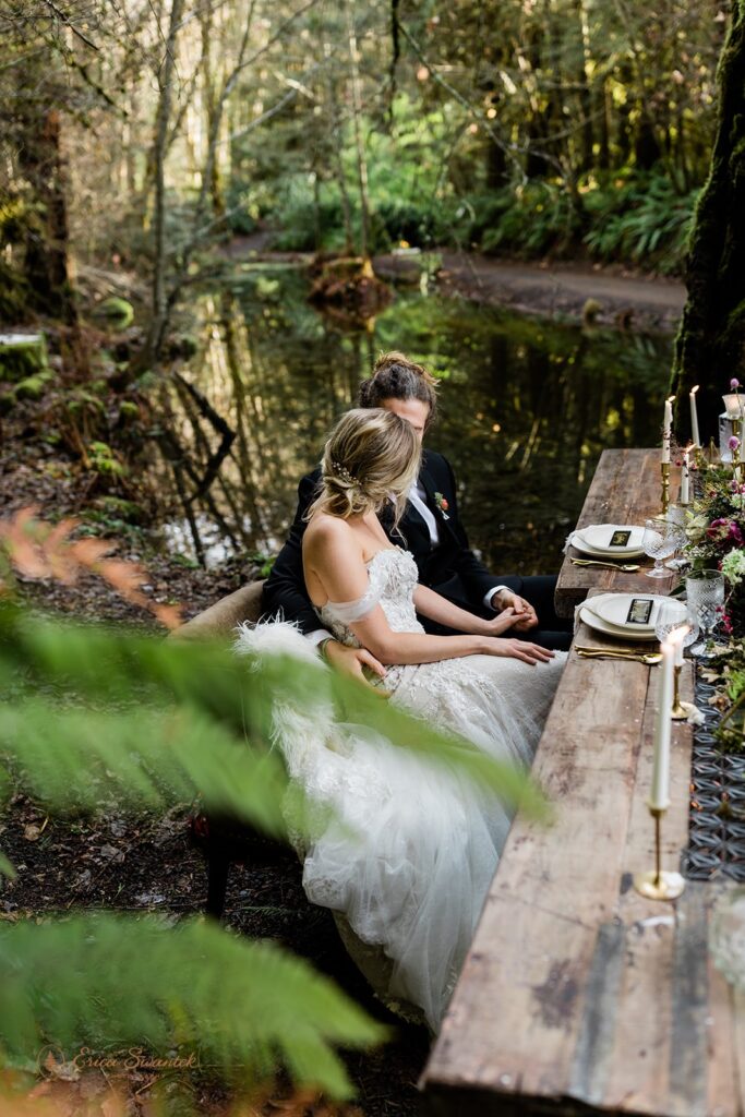 elopement couple snuggling during their winter elopement in the forest in pacific north west
