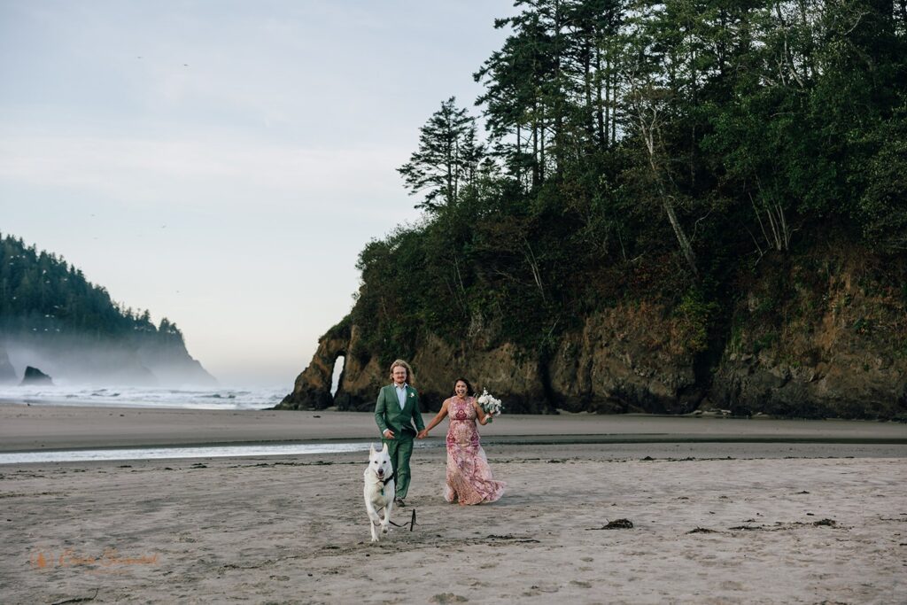 elopement couple walking along the coast during their pnw coastal elopement
