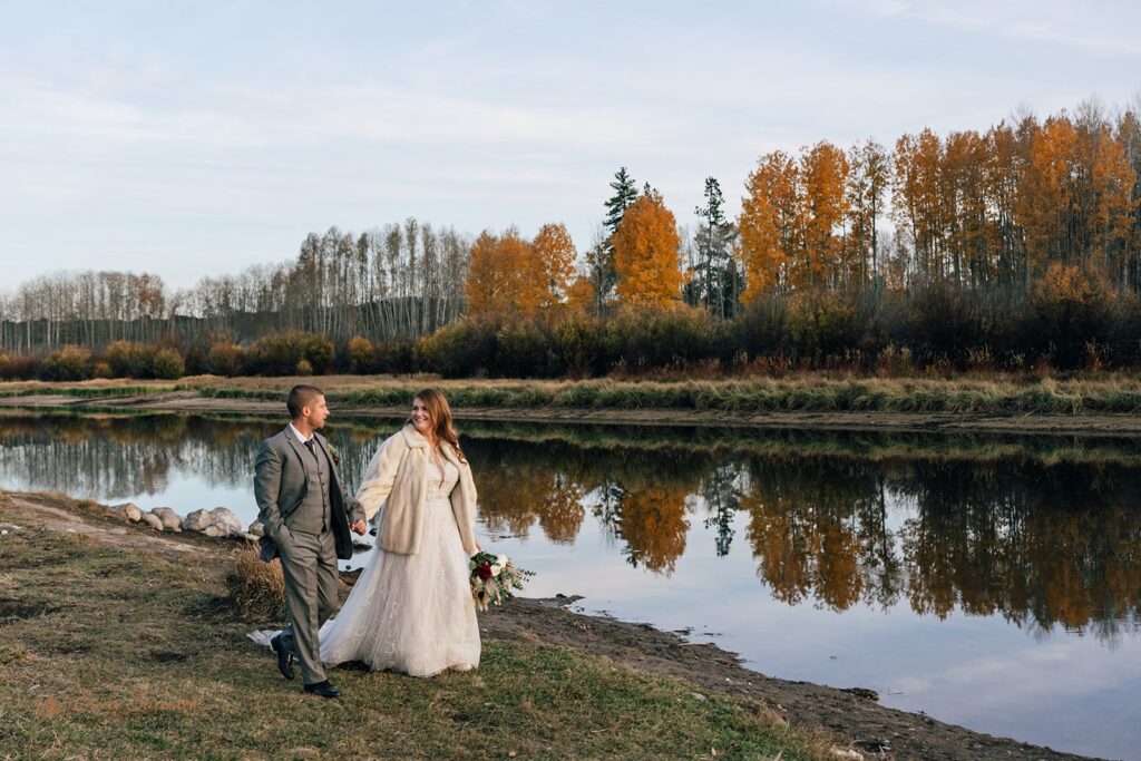 elopement couple surrounded by gorgeous fall landscapes during their bend, or elopement day