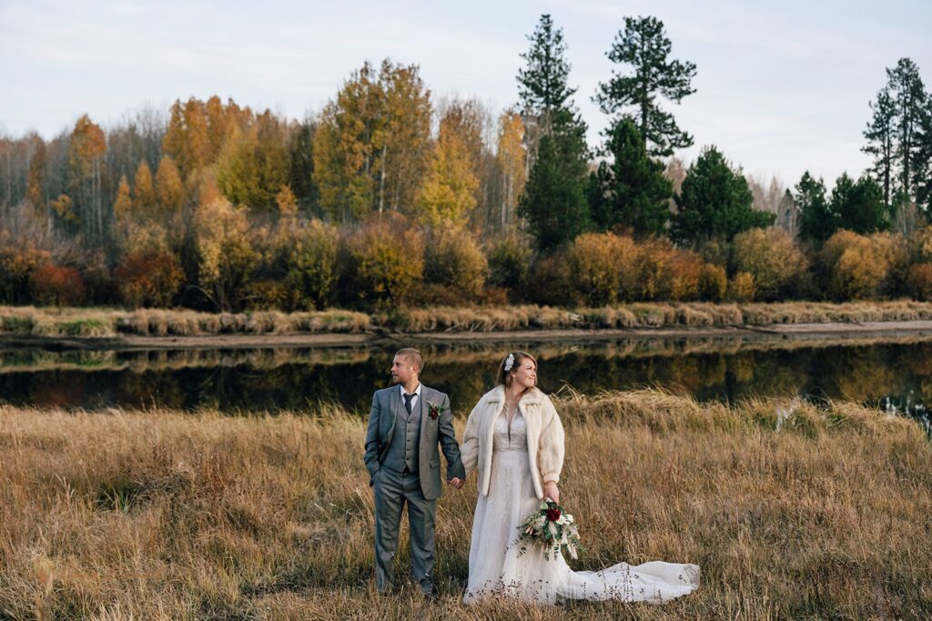 elopement couple surrounded by gorgeous fall landscapes during their bend, or elopement day