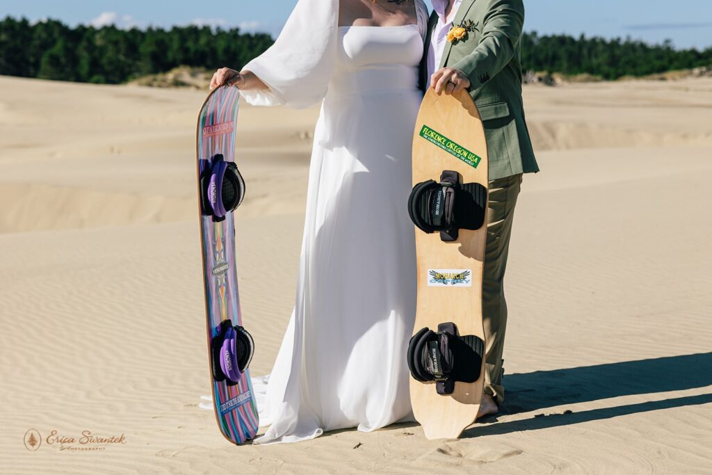 bride and groom sandboarding during their adventure elopement day in the pnw