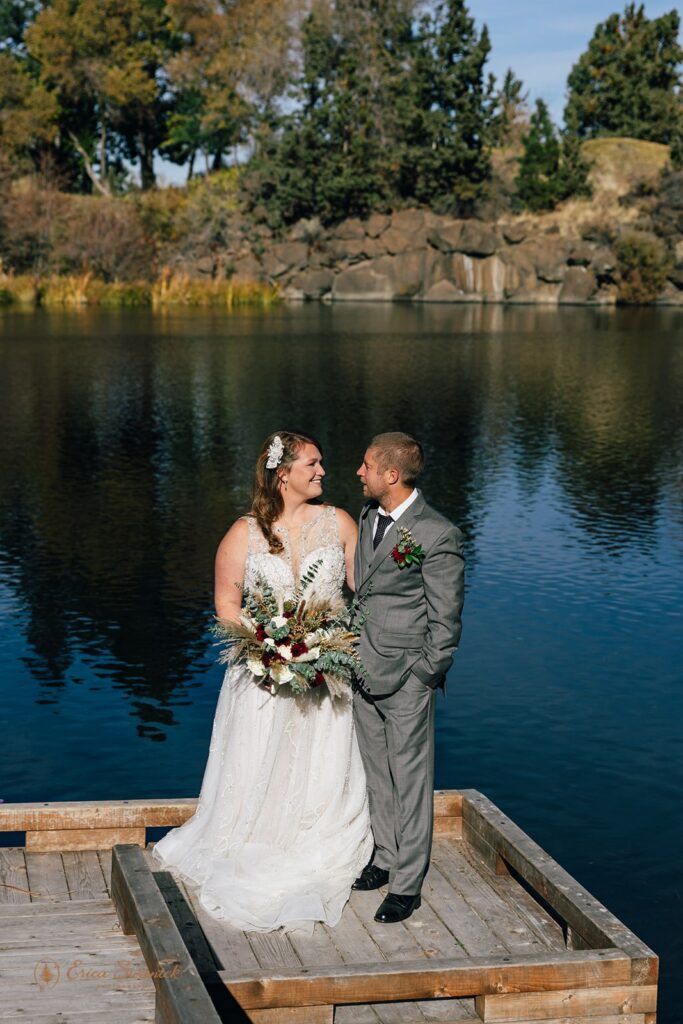 elopement couple surrounded on a lake dock