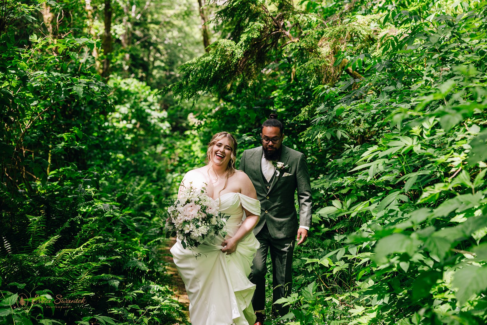 joyful elopement couple in a lush forest during a pnw elopement