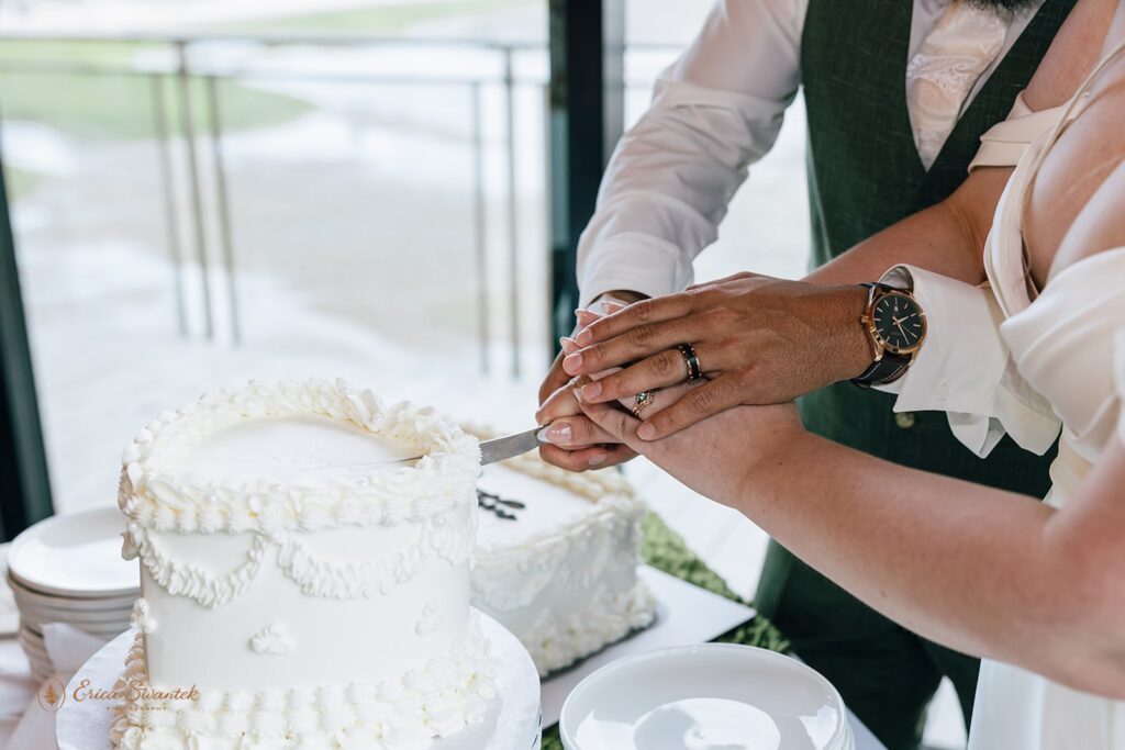 bride and groom cutting cake