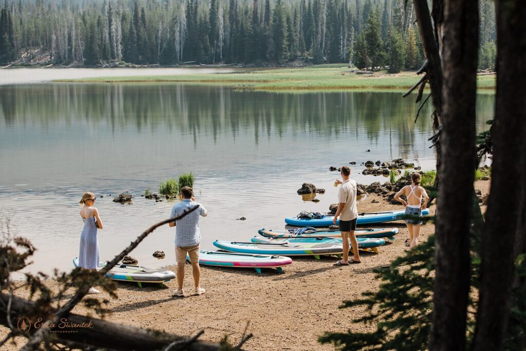 paddle board adventures on sparks lake for an elopement celebration