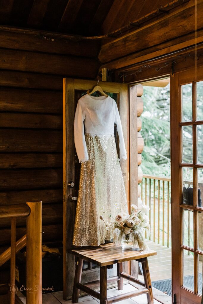 wedding dress hanging from the door