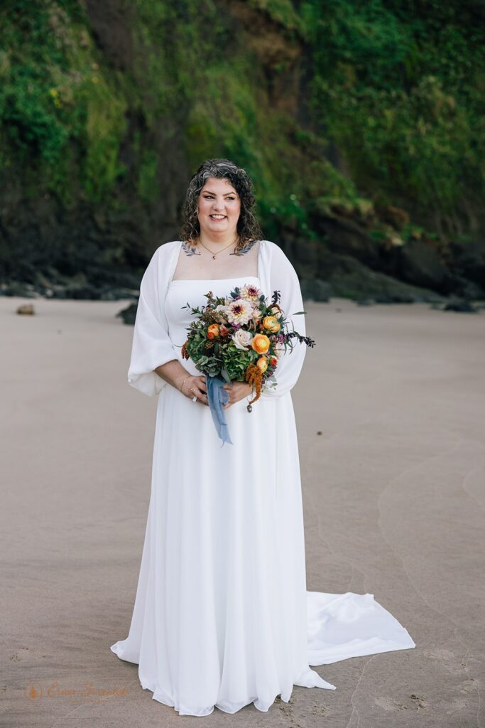 bride holding a colorful elopement bouquet