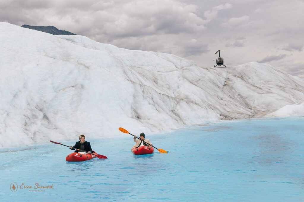 elopement couple kayaking in glacial water