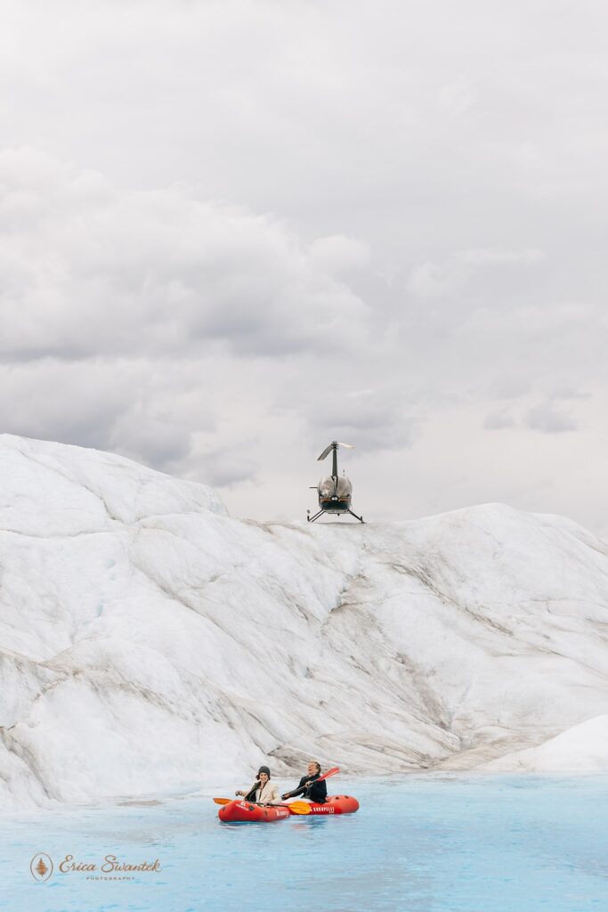 elopement couple kayaking through glacial melt
