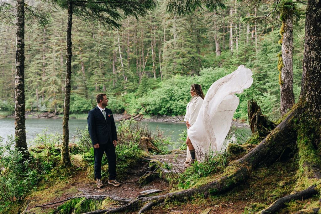 elopement couple in a lush forest during their alaska elopement