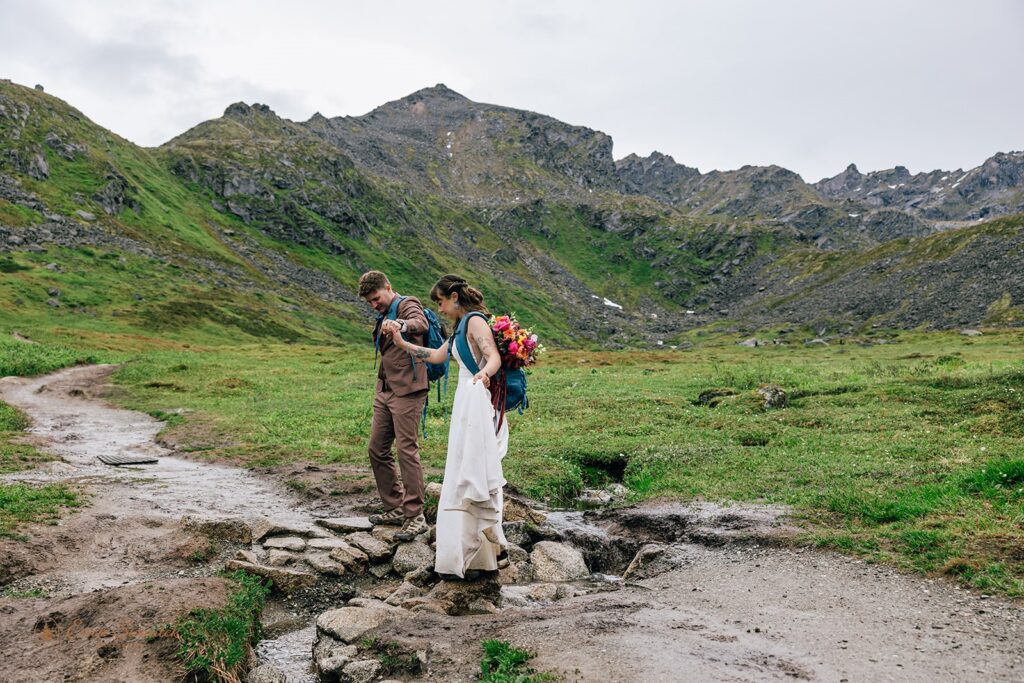 elopement couple hiking together in alaska