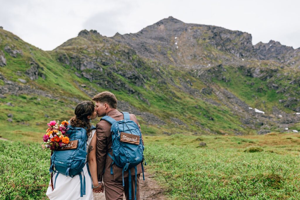 elopement couple hiking together in alaska